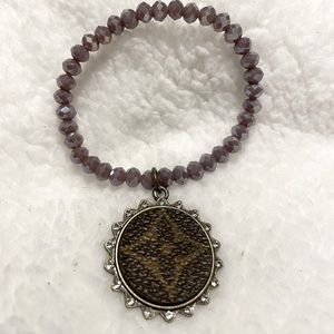 Upcycle, purple beaded, stretch bracelet. Never worn.